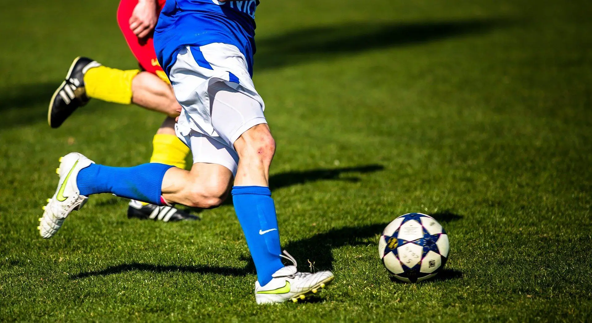 Player dribbling past a defender with a skill move.